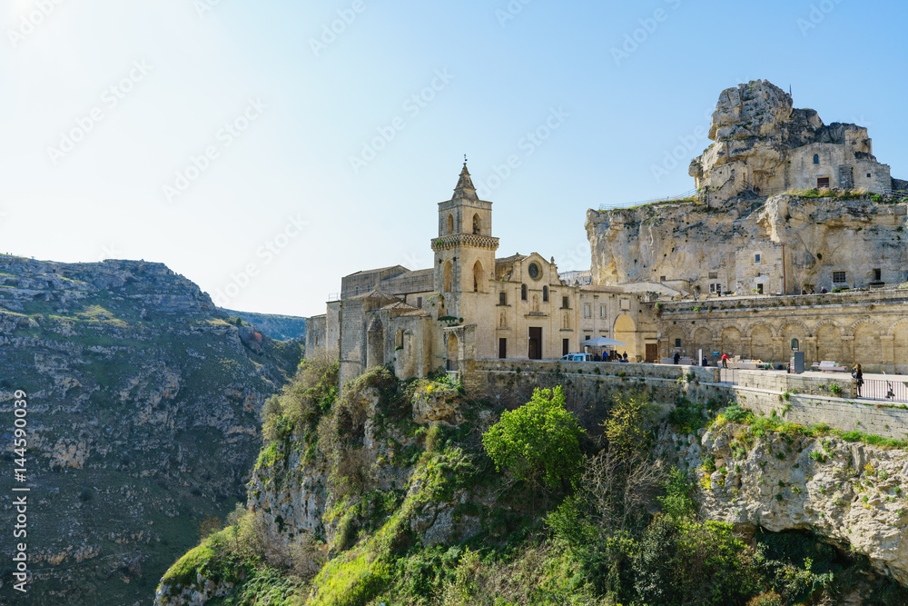 The ancient ghost town of Matera (Sassi di Matera) in beautiful sun shine with blue sky, southern Italy