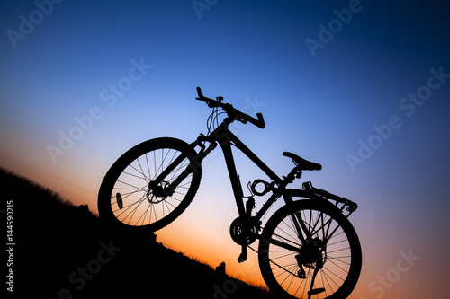 Fototapeta Naklejka Na Ścianę i Meble -  The silhouette of mountain bike