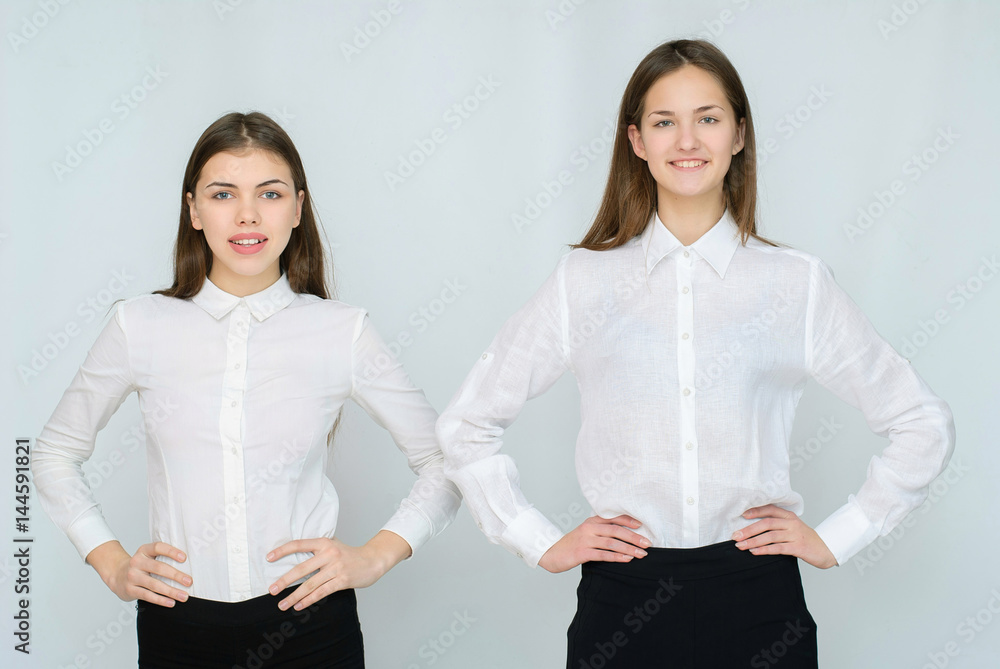 two business models standing with their backs together two business models standing with their backs together
