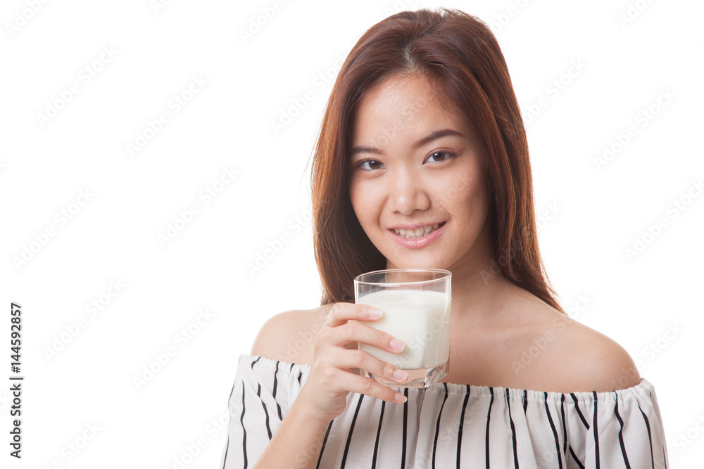 Healthy Asian woman drinking a glass of milk. Healthy Asian woman drinking a glass of milk.