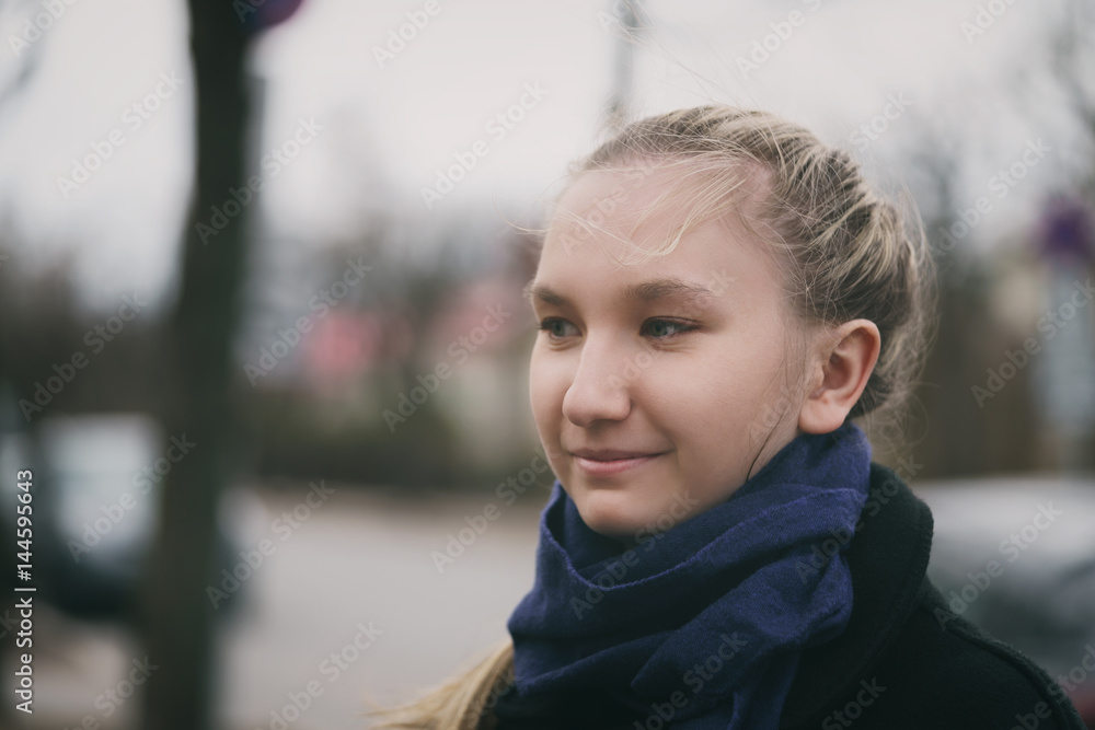 teen girl outdoor spring portrait slightly toned to match cold weather, copy space teen girl outdoor spring portrait slightly toned to match cold weather, copy space