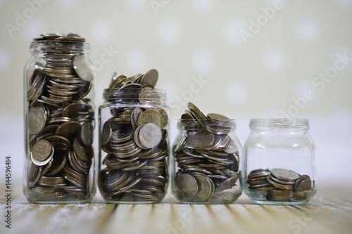 coins stacked in glass jars on the floor russian rubles 