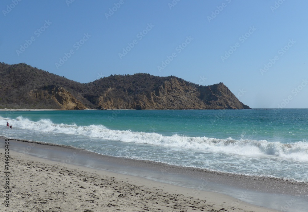 Quiet but beautiful beach on a stunning blue sky day in central Ecuador.