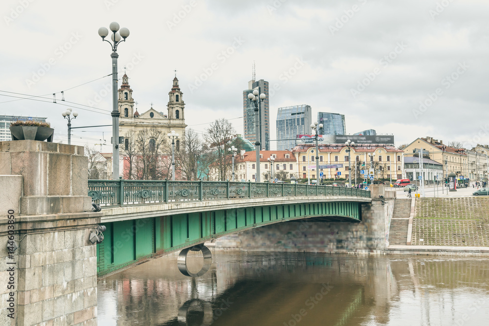 View of Neris river with Green bridge and the Church of the St Raphael the Archangel, Vilnius, Lithuania.