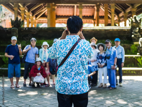 Asian travel group taking a group picture