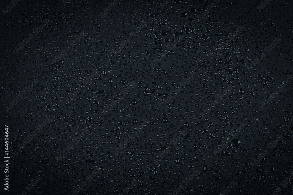 Water drops on dark stone Water drops on dark stone