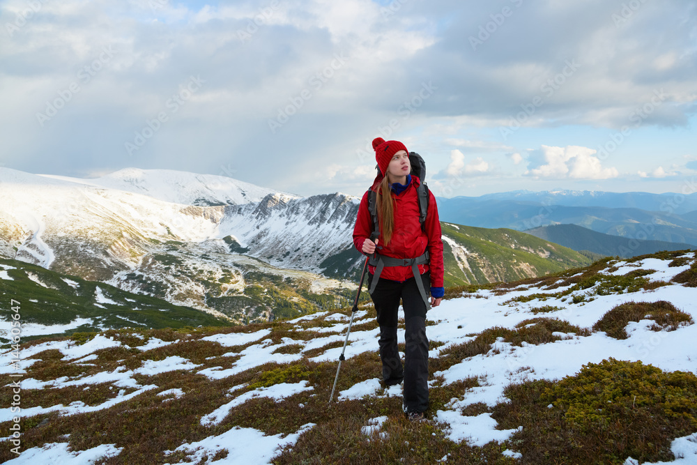 Obraz premium Dreamy blonde girl walking with great sport backpack.