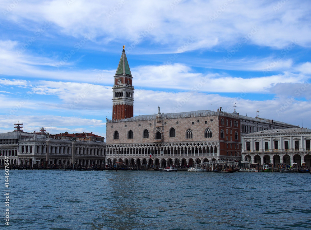 Venice san marco palace from the sea with clouds and blue sky