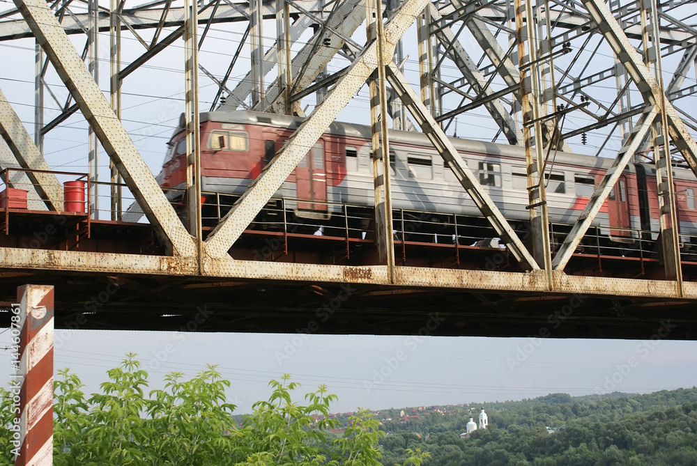 The train goes on railway bridge