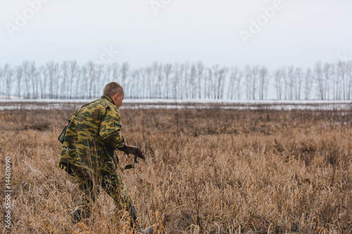 The hunter on hunting. The hunter looks out for a game. The hunter is stolen to production. © Sergey_Siberia88