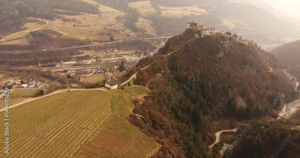 Aerial shot, a small perched town Chiusa in Italy, Sud Tirol, in the middle of the vineyards, 4K Aerial shot, a small perched town Chiusa in Italy, Sud Tirol, in the middle of the vineyards, 4K