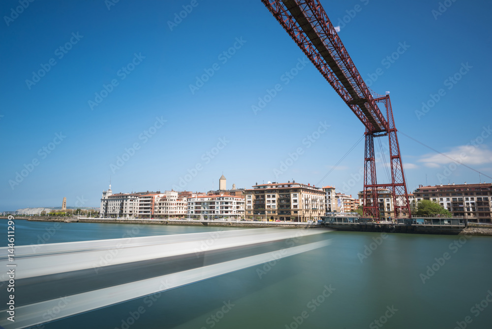 Daylight long exposure of Vizcaya hanging bridge and Nervion river in Portugalete, Bilbao, Spain.