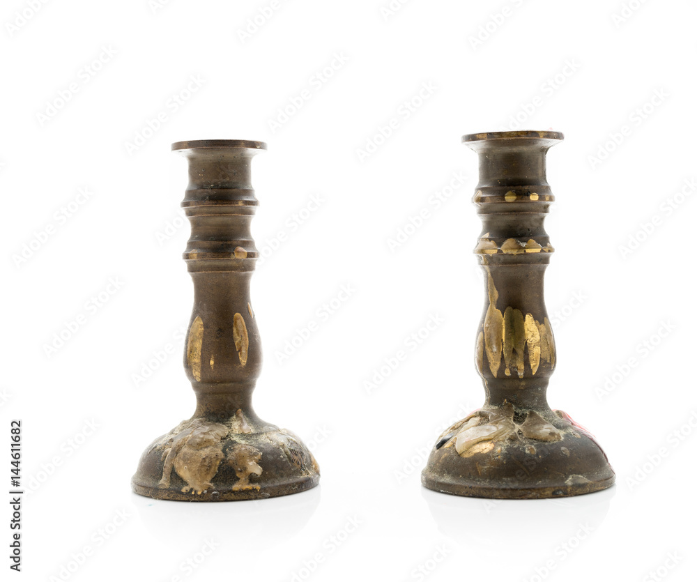 Old Brass Candleholders on White background