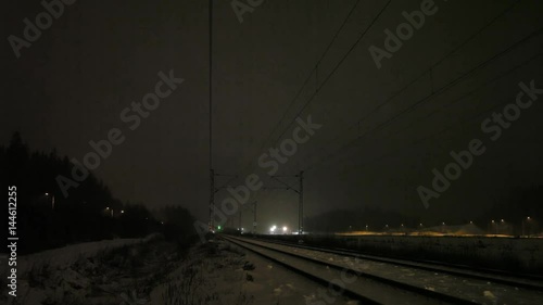 Passenger train on a snowy night