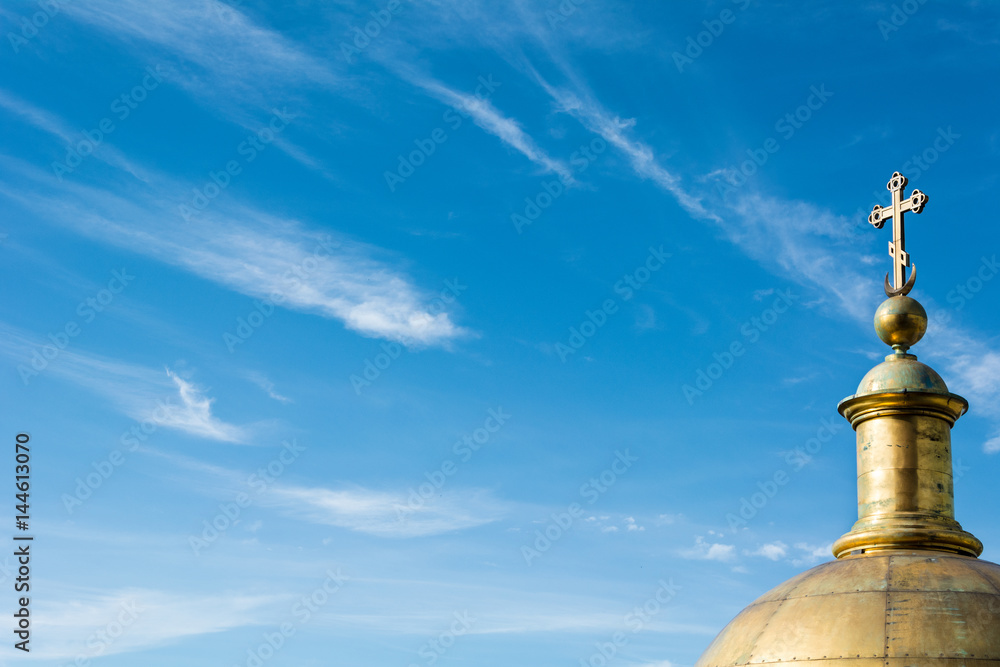 golden dome of the Christian cathedral on a background of the beautiful sky