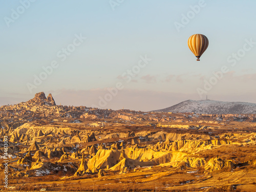 Hot air balloons flying over the mountain in Cappadocia Goreme National Park Turkey