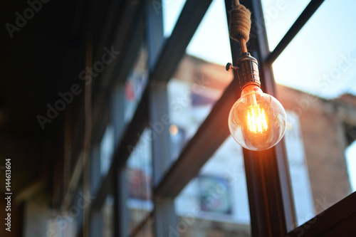 Beautiful retro style . Incandescent lamps in a modern cafe