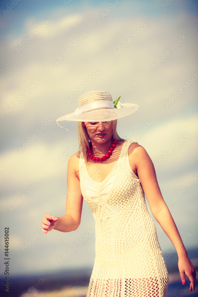 Portrait of beautiful woman during summer