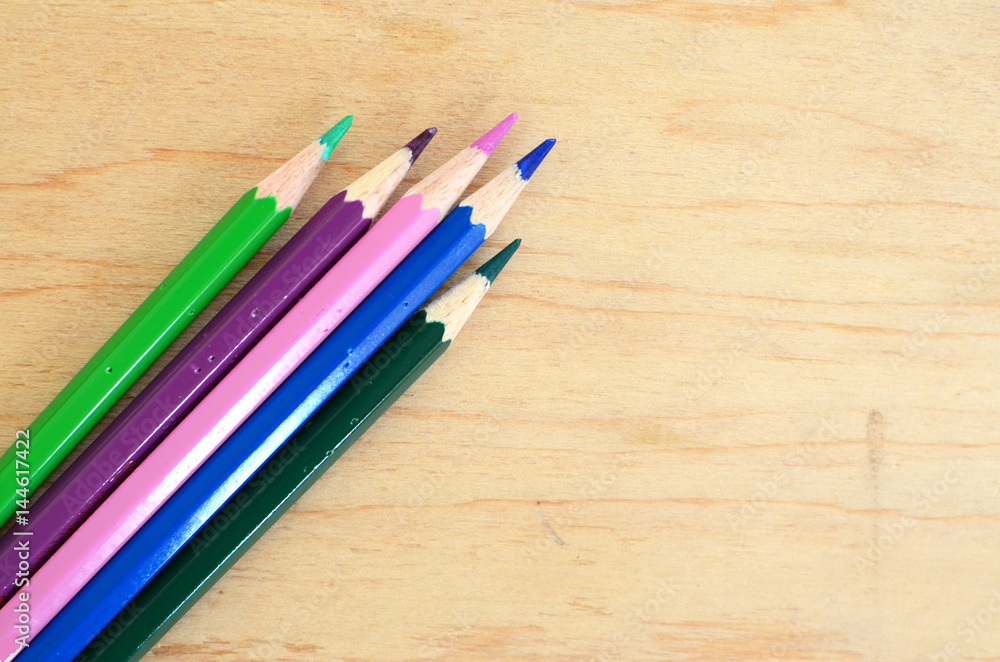 Colorful pencils on the board Colorful pencils on the board