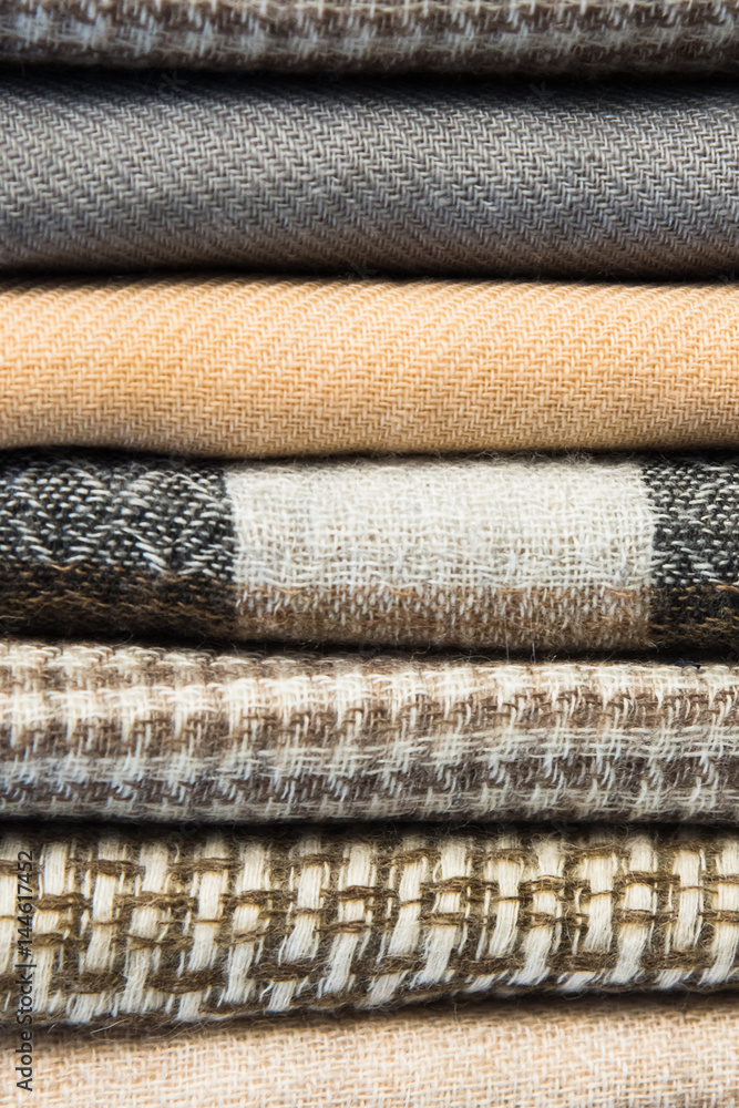 Bright, colorful Turkish fabrics, bedspreads and kerchiefs with different oriental patterns. The texture of the textile or fabric, macro. Tissue, textile, cloth, material, woven. Bright, colorful Turkish fabrics, bedspreads and kerchiefs with different oriental patterns. The texture of the textile or fabric, macro. Tissue, textile, cloth, material, woven.