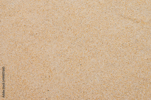 closeup of sand background pattern of a beach in the summer