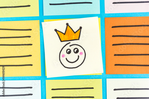 Happy king emoticon note paper concept. Content marketing concept.