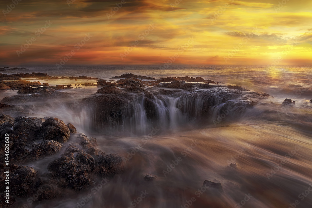 Thors Well at Oregon Coast at fiery sunset 