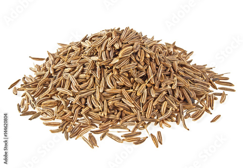 Pile of cumin seeds isolated on white background