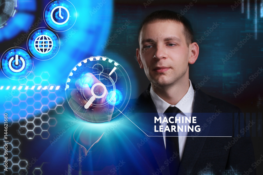 Business, Technology, Internet and network concept. Young businessman working on a virtual screen of the future and sees the inscription: Machine learning Business, Technology, Internet and network concept. Young businessman working on a virtual screen of the future and sees the inscription: Machine learning