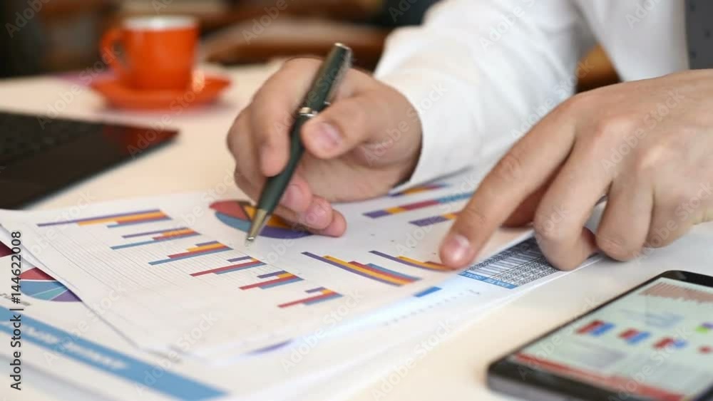 Business Broker Analyzing Stock Data And Charts On Paper. Paperwork Concept. Business Broker Analyzing Stock Data And Charts On Paper. Paperwork Concept.