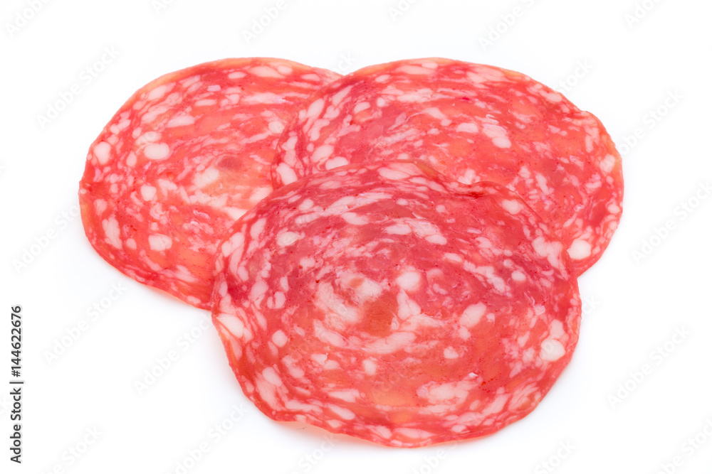 Salami smoked sausage slices isolated on white background cutout. Salami smoked sausage slices isolated on white background cutout.