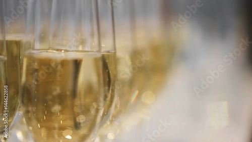 close up refocusing shot of many glasses of champagne on the table