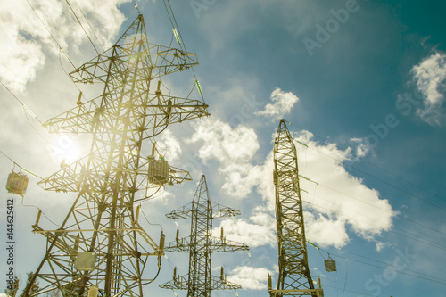 Power line against the blue sky photo