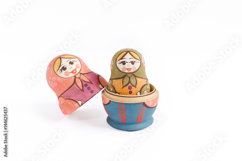 Russian dolls babushka  or matreshka  or Colorful Russian nesting dolls isolated on a white background. Russia nesting doll is a very popular souvenir  locally made.