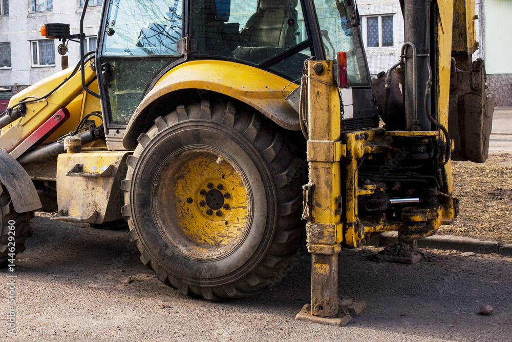 yellow tractor on the street yellow tractor on the street