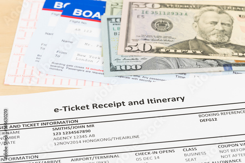E-ticket, dollar money banknote, and boarding pass; these documents are mock-up