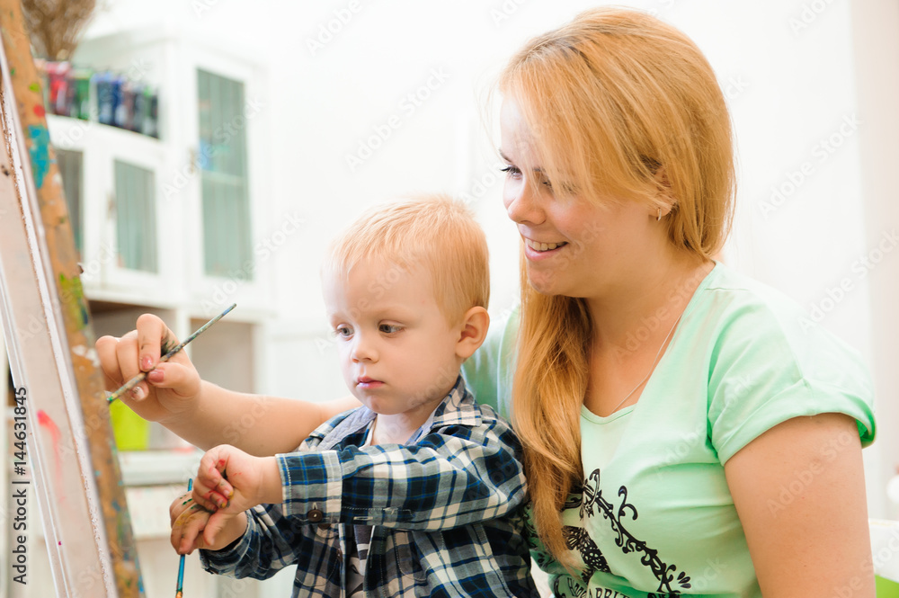 Mother and child draw a picture paints, art lesson Mother and child draw a picture paints, art lesson
