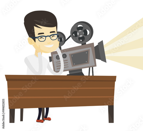 Asian projectionist showing new film.