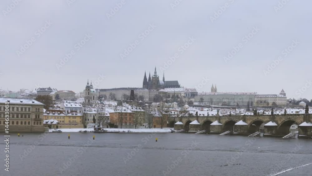 View of Charles Bridge and Castle in Prague Under the Snow in Winter View of Charles Bridge and Castle in Prague Under the Snow in Winter