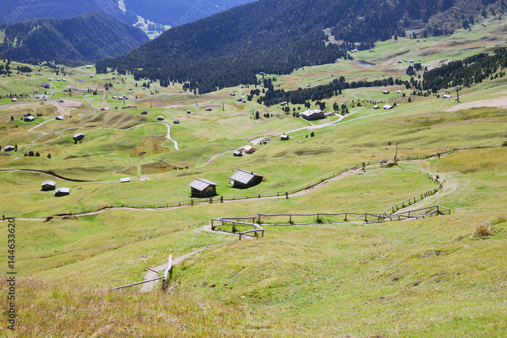 Valley with houses in Dolomite Alps