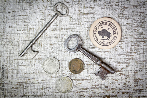 Wooden nickel coins and skeleton keys © CLShebley