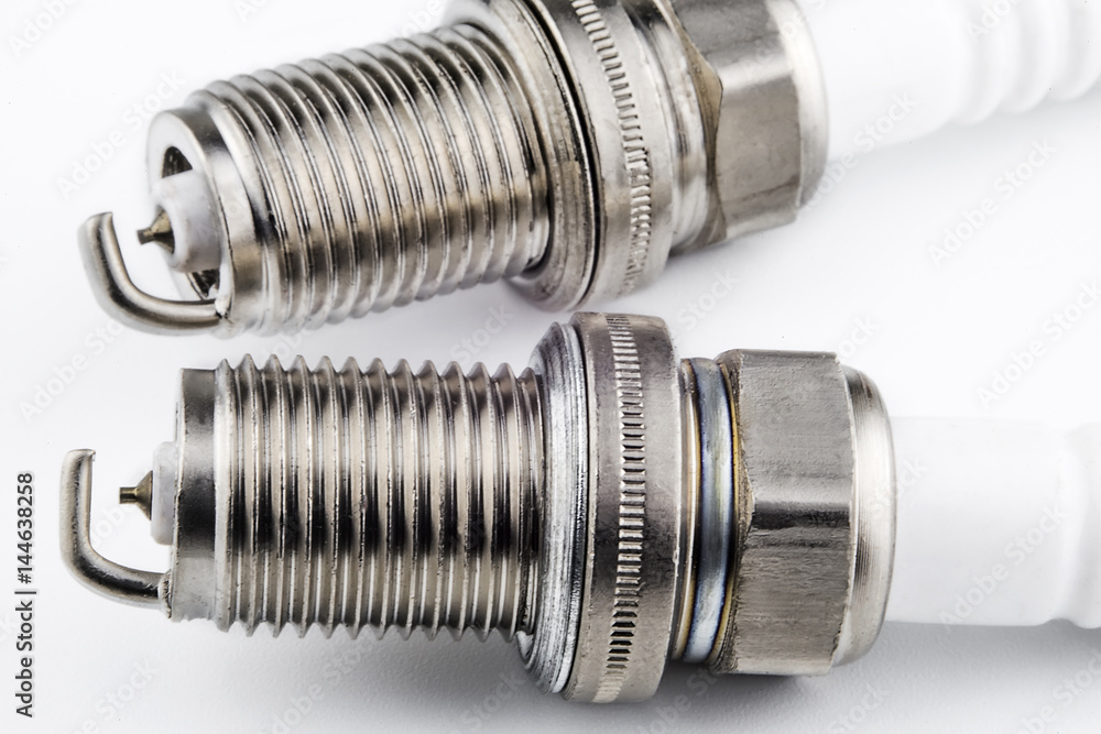 Spark plugs on a light background Spark plugs on a light background