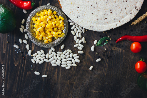 Mexican food - tortilla with vegetables, corn and beans.