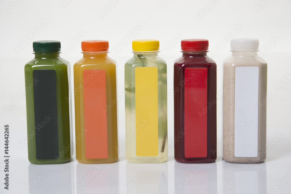Bottles with juice on the white background Bottles with juice on the white background