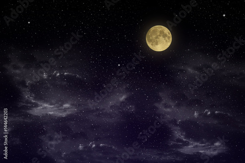 Beautiful magic blue sky with clouds and fullmoon and stars at night closeup 