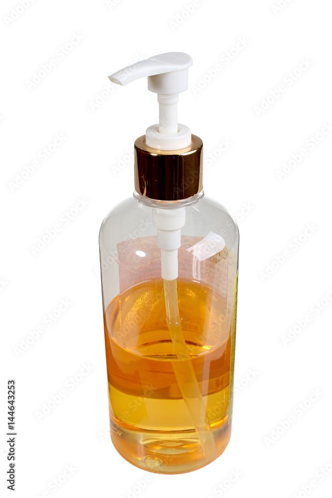 Spray bottle with mango massage oil isolated on white background Spray bottle with mango massage oil isolated on white background