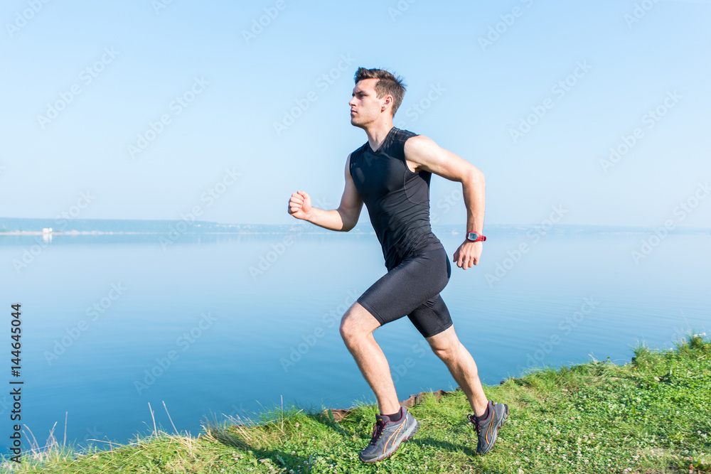 Young jogger running in morning Athlete runner working out cardio. Young jogger running in morning Athlete runner working out cardio.