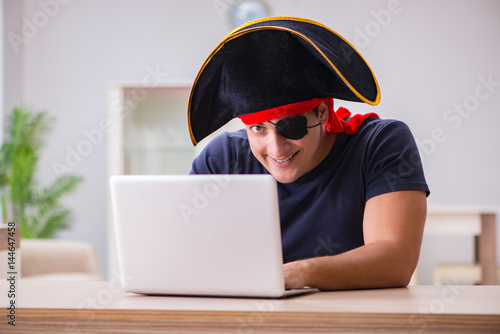 Картината върху платно Digital security concept with pirate at computer
