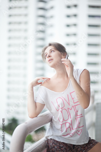 Free Download Woman smoking cigarette on the balcony - GFXLoad