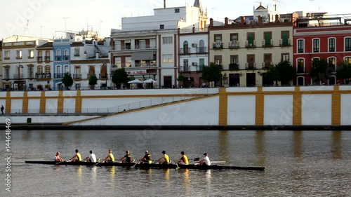 SEVILLE, SPAIN - APRIL 14: Men in canoe on the Guadalquivir river. April 14, 2017 in Seville, Spain.